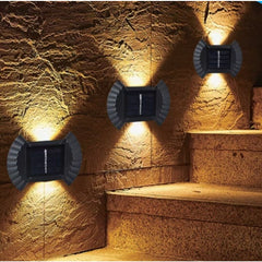 Set 4 Aplice solare LED Bidirectionale pentru perete Practicpentrucasa, in forma de funda, 8 LED-uri, material ABS si PC, lumina puternica, IP65, 10 x 7.5 cm, baterie 1.2 V, 300 mAh, autonomie 8-10 ore, alb cald