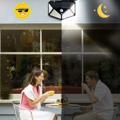 Lampa cu incarcare solara pentru exterior, 100 LED cu distanta de inductie, montaj pe perete, fara cabluri, cu 4 fete, Practicpentrucasa