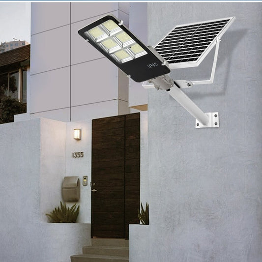 Lampa solara stradala Practicpentrucasa, IP65, senzor de lumina, 417 LED-uri SMD, 24000 lm, 300W, autonomie 12-16 ore, telecomanda, montare prin fixare, pentru strada sau gradina, finisaj lucios, material ABS, 49.5 x 21 x 6.5 cm, lumina alb rece