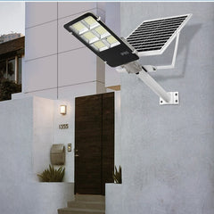 Lampa solara stradala Practicpentrucasa, IP65, senzor de lumina, 417 LED-uri SMD, 24000 lm, 300W, autonomie 12-16 ore, telecomanda, montare prin fixare, pentru strada sau gradina, finisaj lucios, material ABS, 49.5 x 21 x 6.5 cm, lumina alb rece
