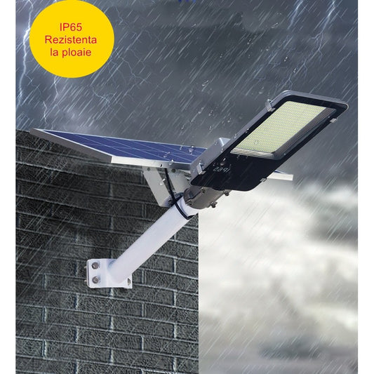 Lampa solara stradala Practicpentrucasa, pentru curte sau strada, finisaj lucios, rezistent la apa, montare prin fixare, senzor lumina, baterie de litiu, IP65, lumina rece, putere 200W, autonomie 10 ore, 49 x 21 x 6.5 cm, negru